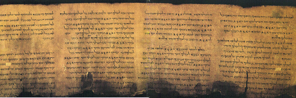 Ancient Dead Sea Scroll manuscript displayed in a museum setting.