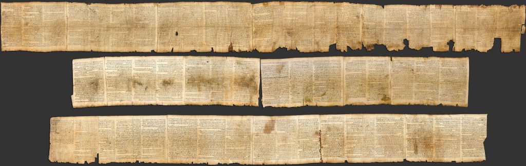 Photographic reproduction of the Great Isaiah Scroll from Qumran, showing long columns of ancient Hebrew text from the Book of Isaiah.